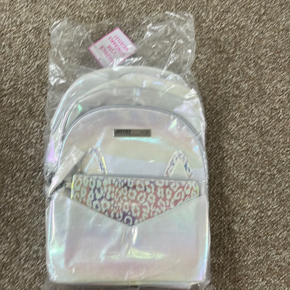 Justice backpack with detachable wristlet. Brand new!